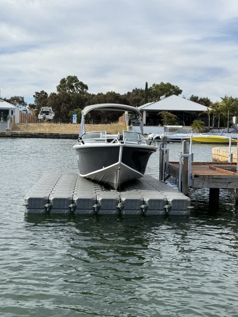 Image of a boat docked on a floating dock