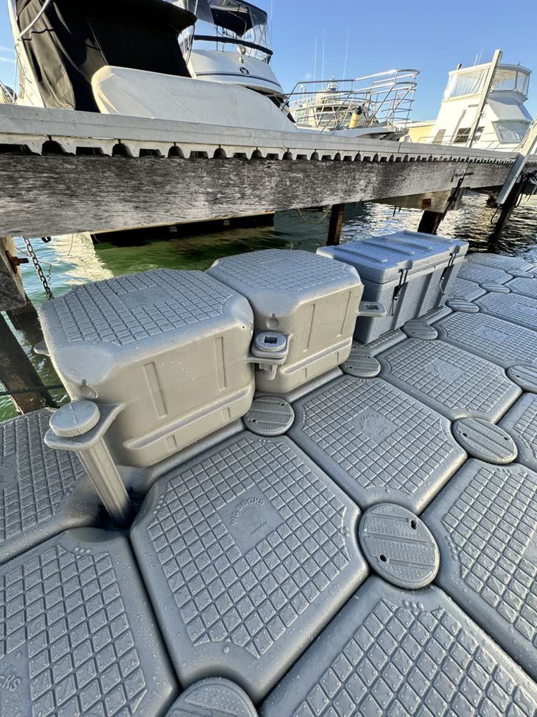 Boxes and platform used as steps on a floating dock