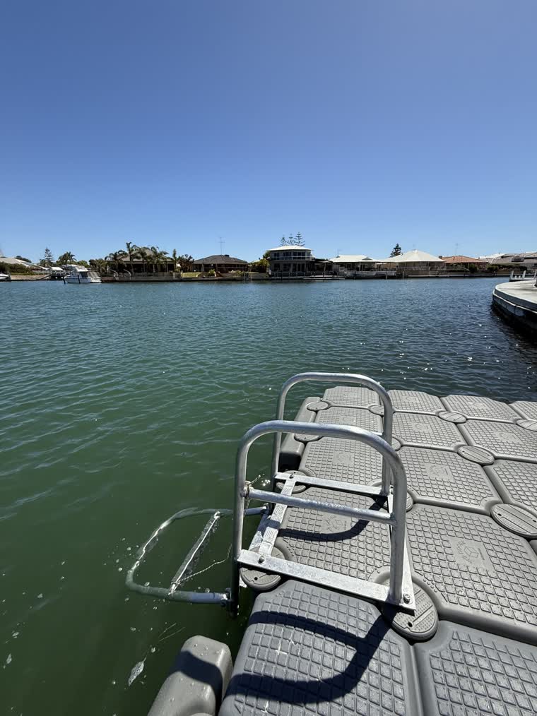 Close up image of the swim platform dock with a metal structure for docking purposes