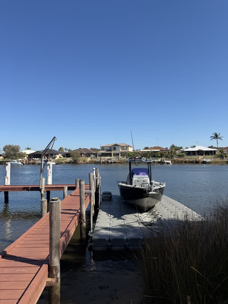 Image of a boat on a dock by the side of a pier